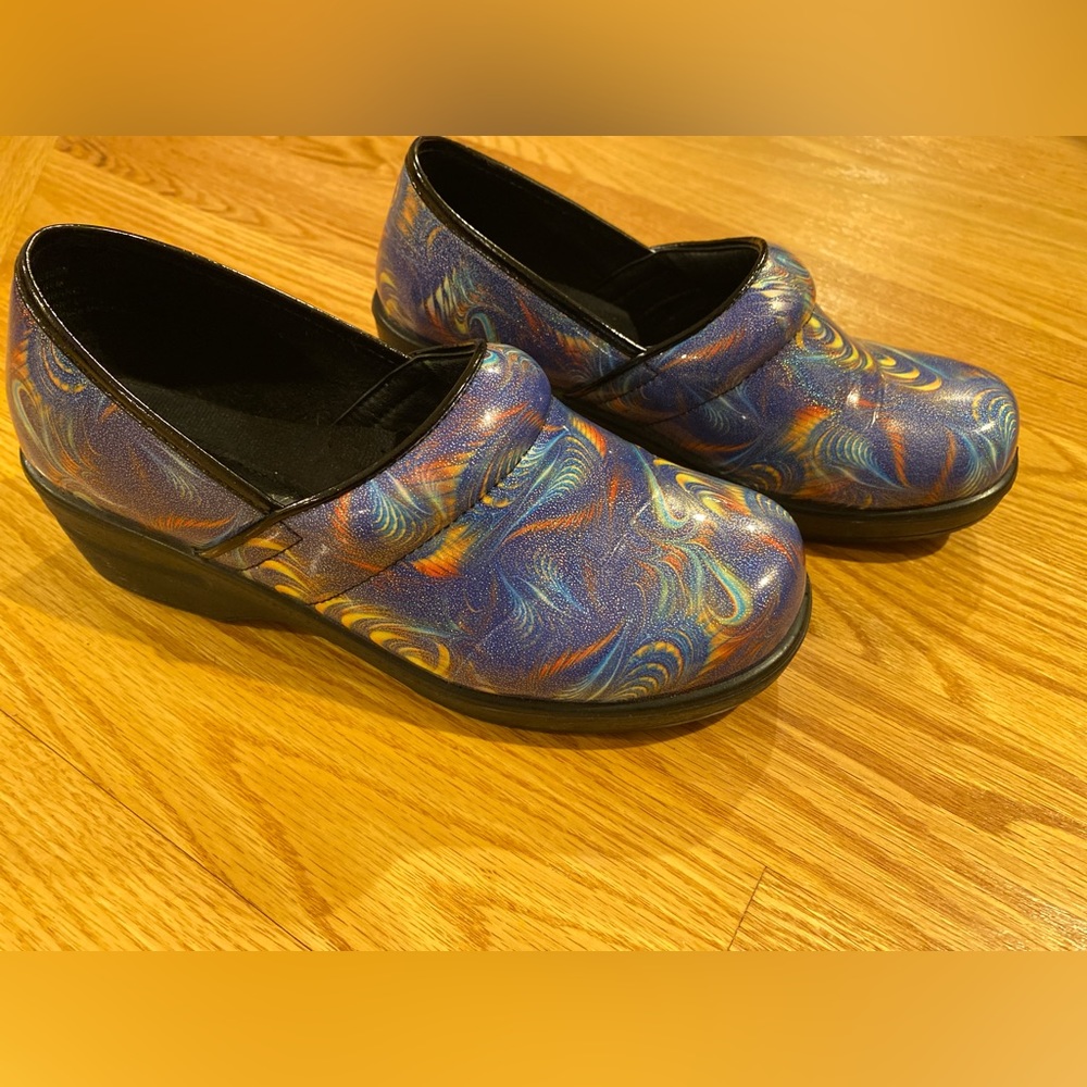 Nursing clogs in a fun blue swirl pattern with multiple colors.
